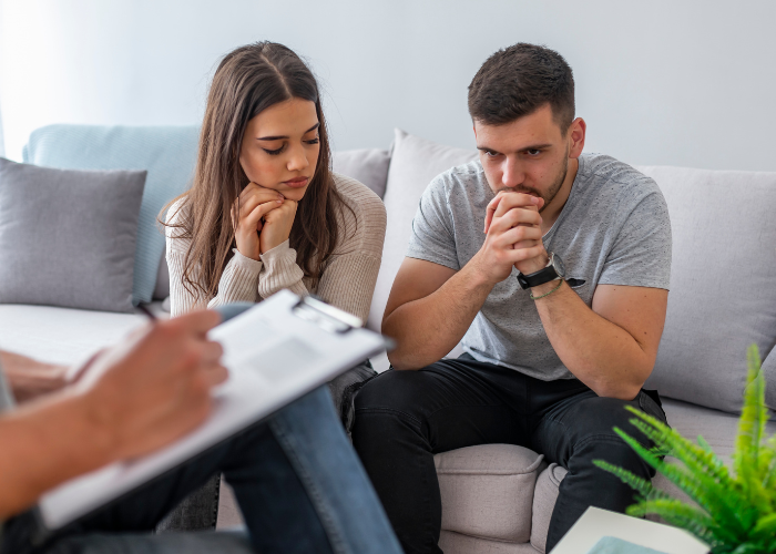 An image of 2 couples taking a therapy session