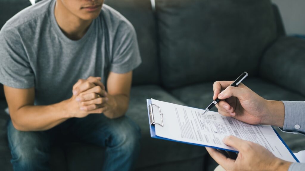 an image of a man looking pleading to a therapist